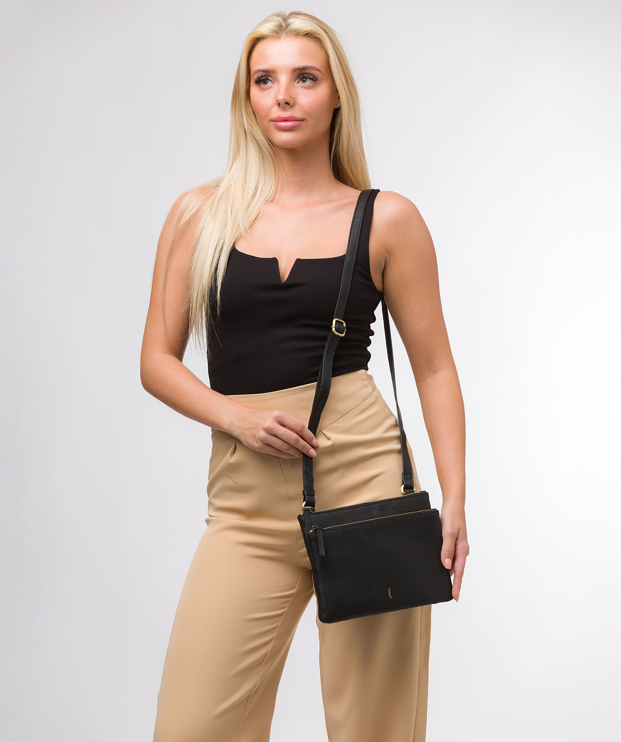 Flat lay showing Demi bag structure and proportions