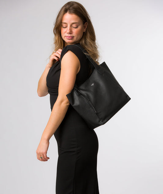 Cami tote bag side profile showing leather texture