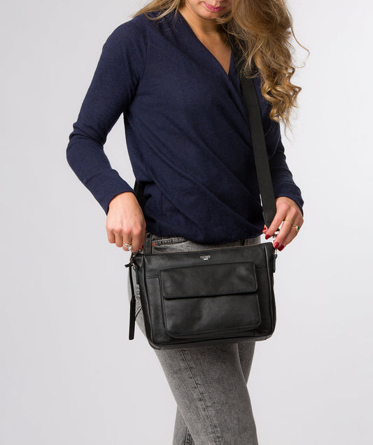 Orly crossbody bag side profile with adjustable canvas strap