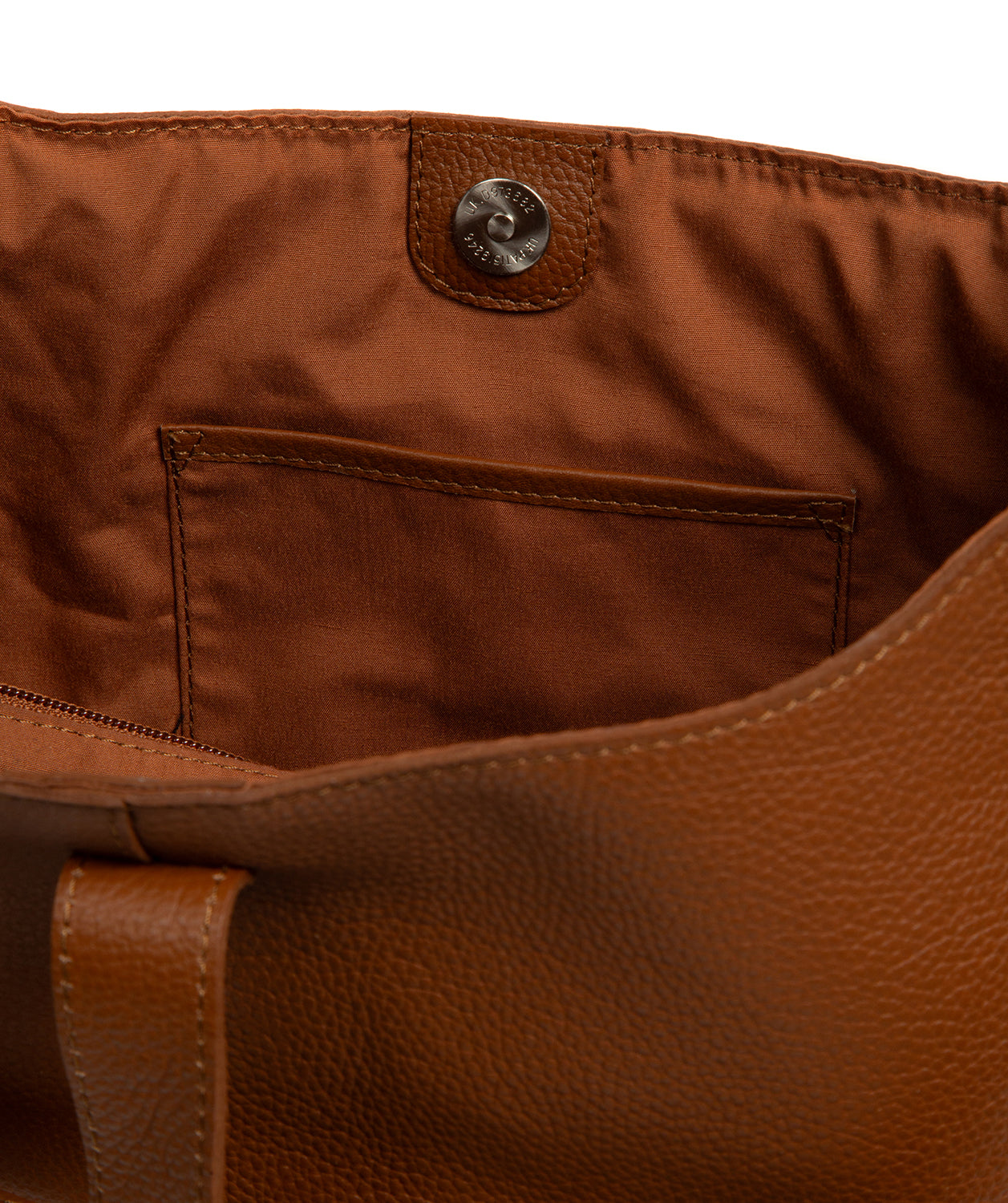 Interior zip pocket and slip pocket storage details