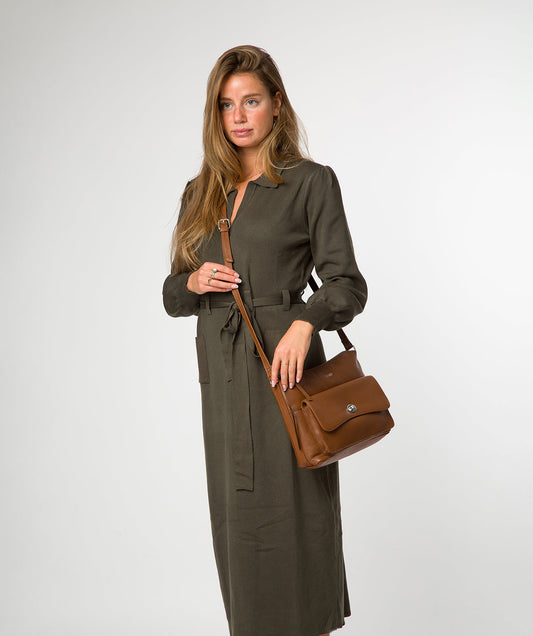 Sylvie shoulder bag side profile showing adjustable leather strap