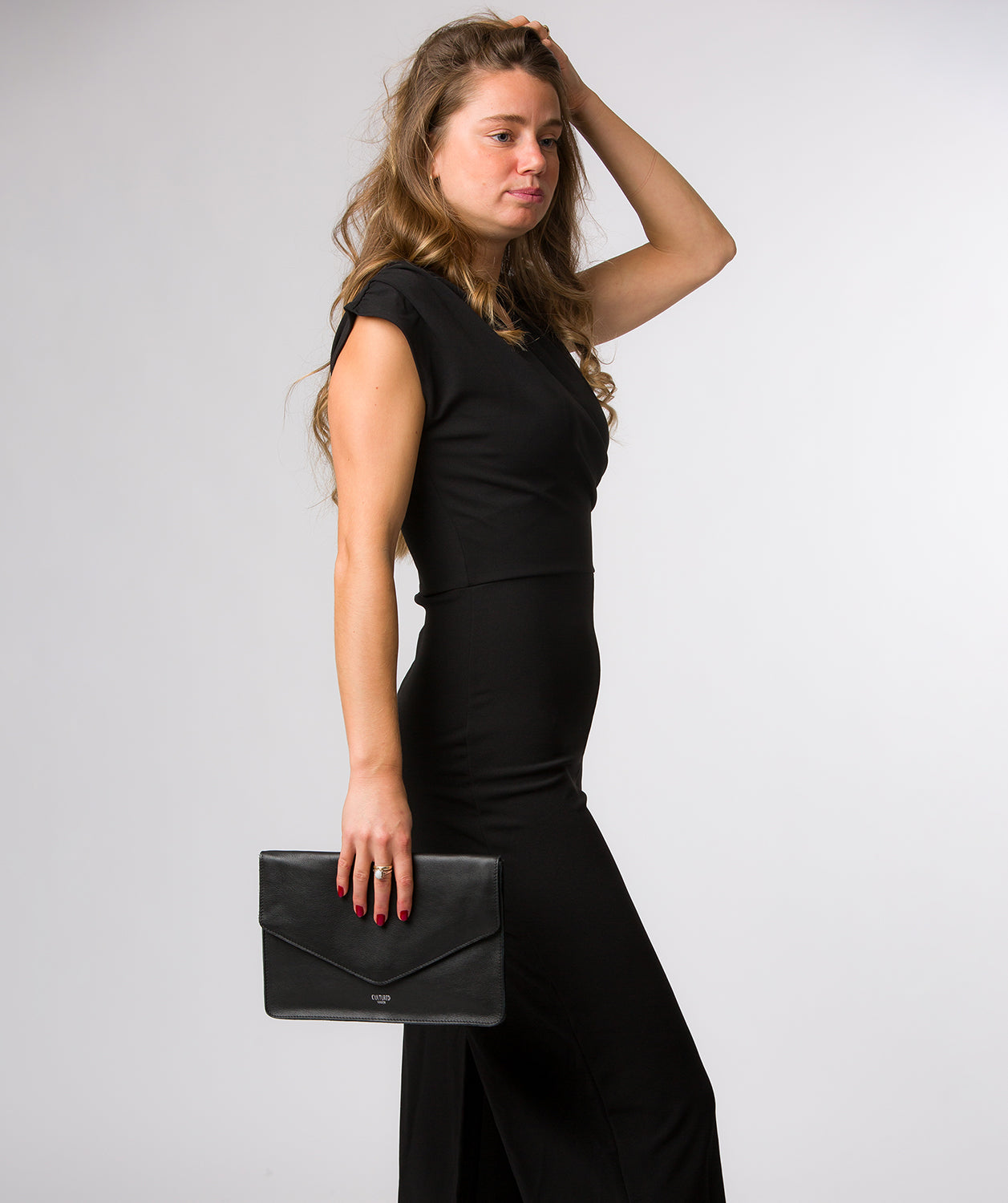 Yara clutch bag fold-over envelope design detail