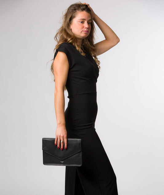 Yara clutch bag fold-over envelope design detail