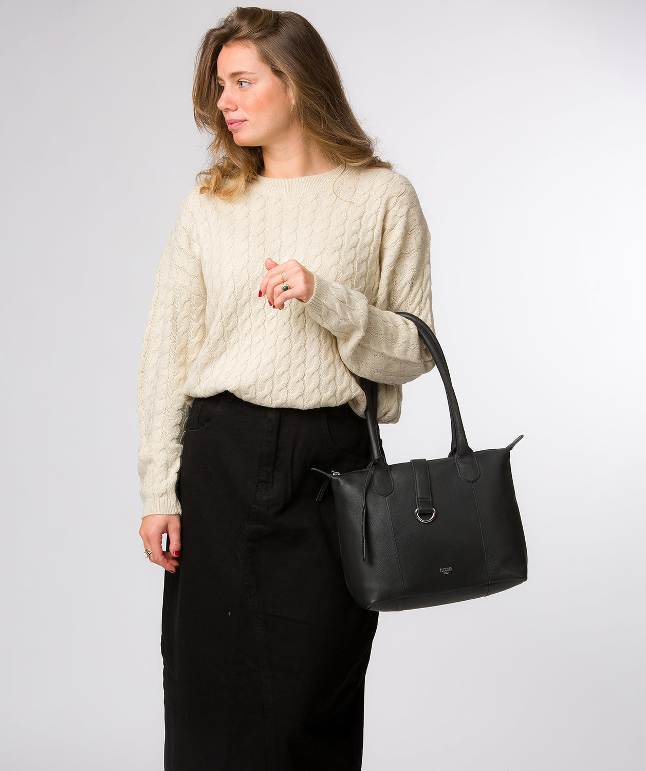 Black leather tote with zip-top closure detail