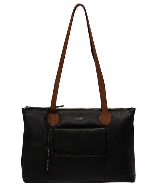 Solange tote bag side profile showing leather handles