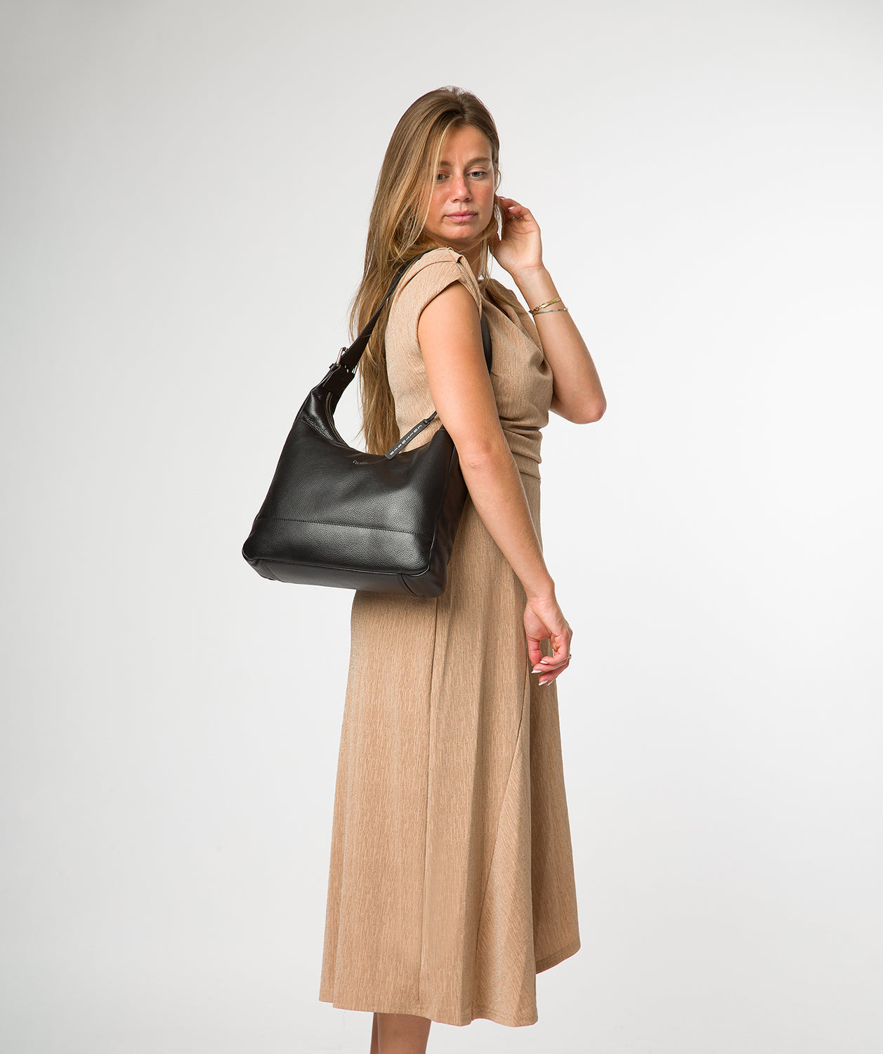 Interior view with slip pocket and zipped compartment detail
