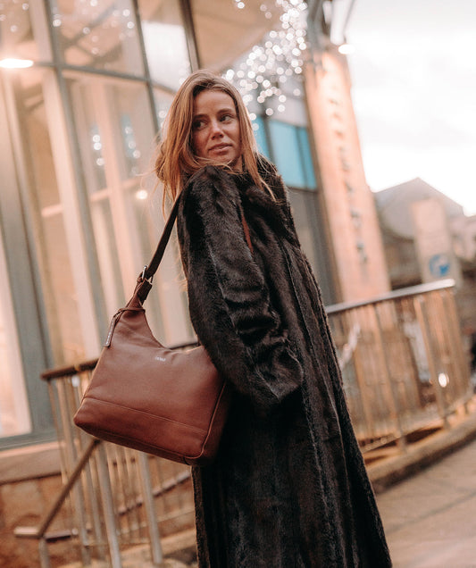 Kovo shoulder bag styled in lifestyle setting with adjustable strap